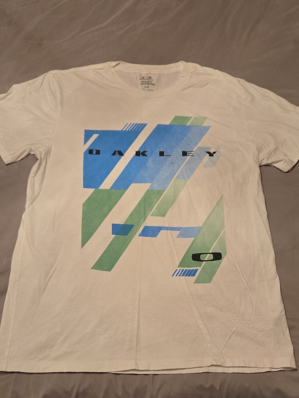 Oakley White Short Sleeve Tee with Blue & Green Geometric Print